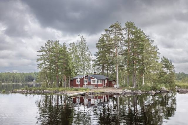 Exterior view of the cottage and lake