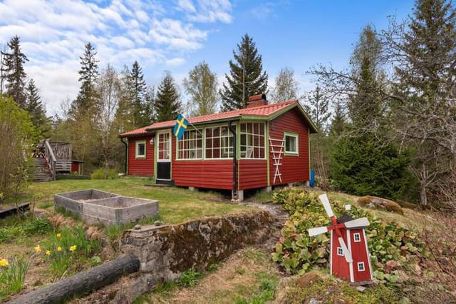 Front view of the cottage and garden