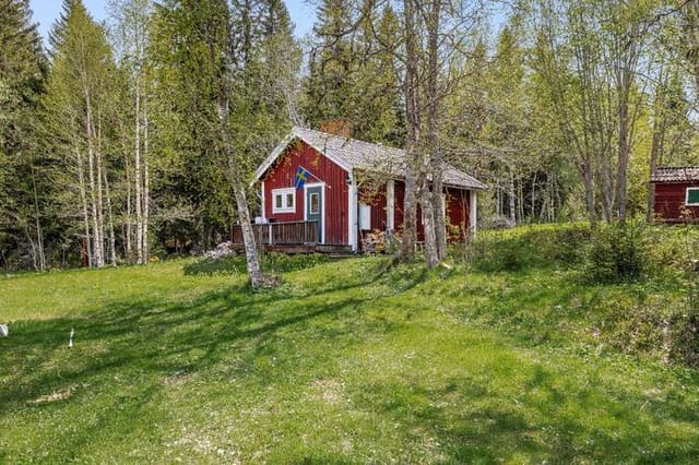 Exterior view of the house and surrounding landscape