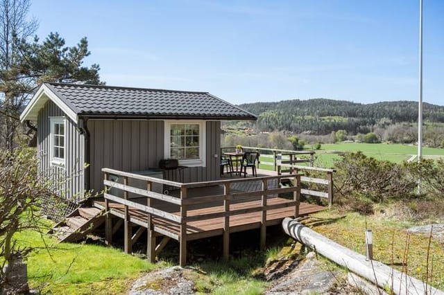 Exterior view of the main cottage and deck