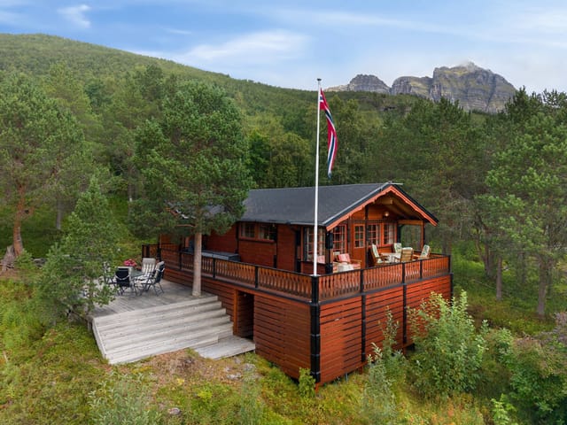 Front view of the property with stunning fjord and mountain backdrop