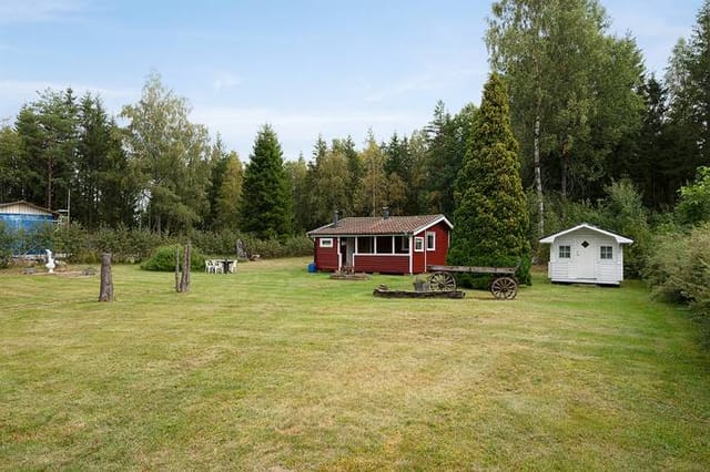 Front view of the red cottage