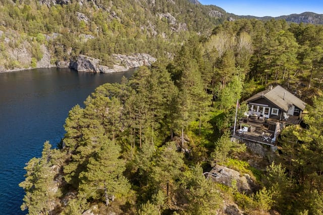 Front view of the cabin with panoramic fjord views