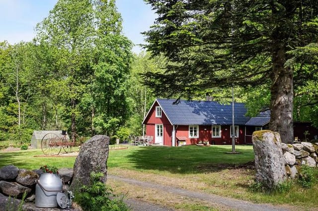 Front view of the red cottage