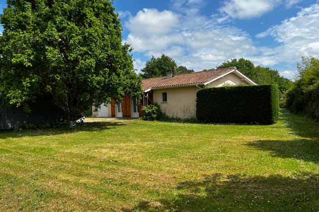 Front view of the bungalow and garden