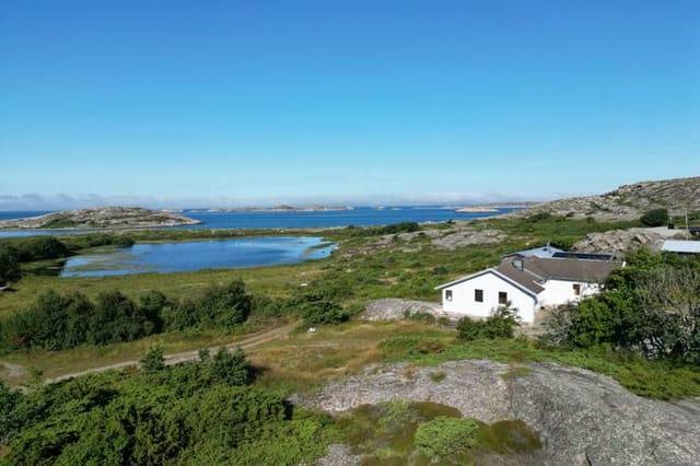 Front view of the house with sea in the background