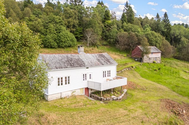 Front view of the farmhouse and property