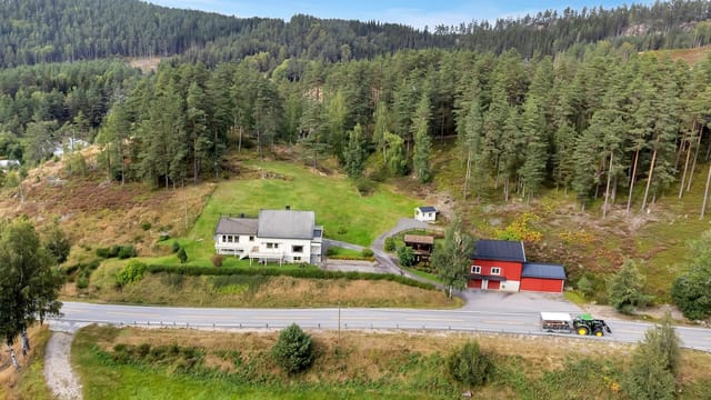 Whole duplex with outbuilding, 4 garage spaces, and carport