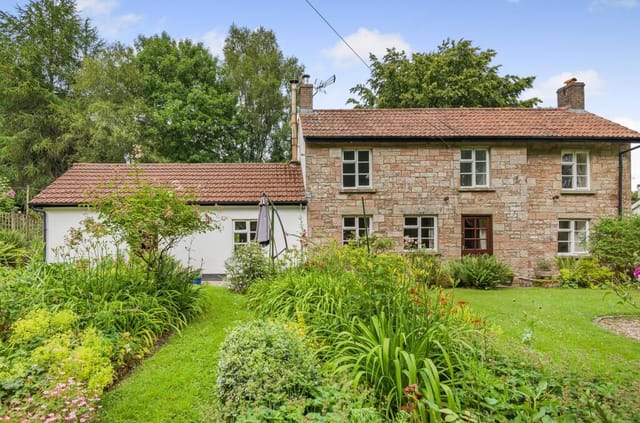 Front view of the stone-built cottage