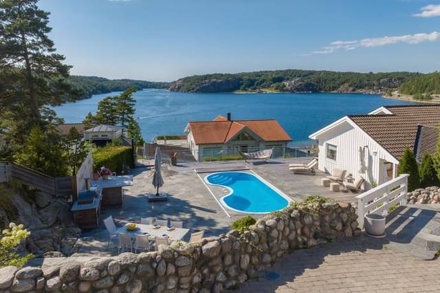 Front view of the house with sea in the background
