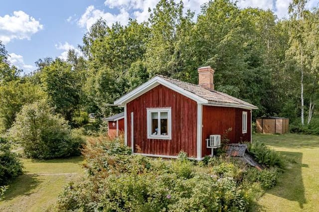 Front view of the red cottage