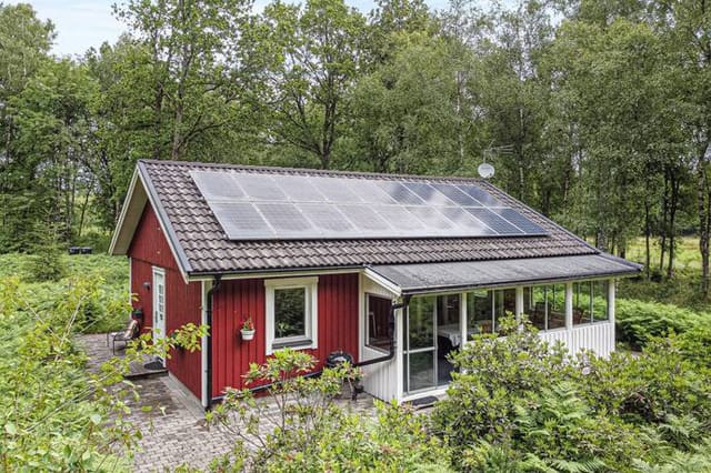 Exterior view of the red holiday home
