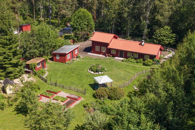 Exterior view of the timber house and garden