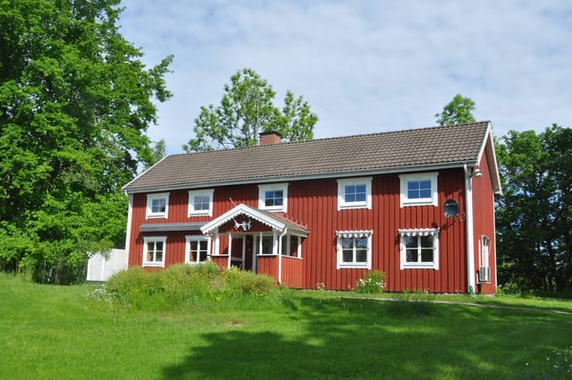 Front view of the country home and garden