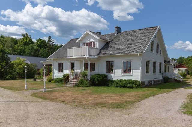 Main house and stables, lakefront view