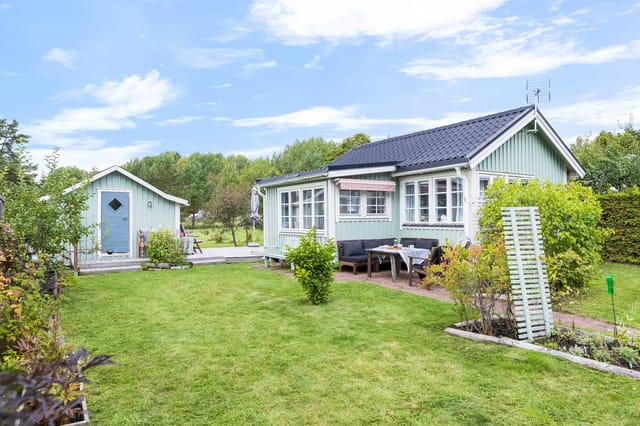 Front view of the summer cottage and garden
