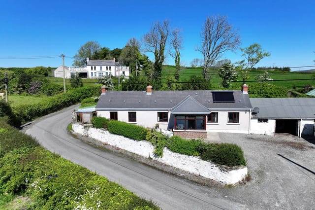 Front view of the property with sea views