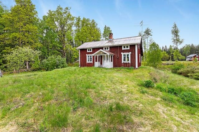 Exterior view of the cottage and barn