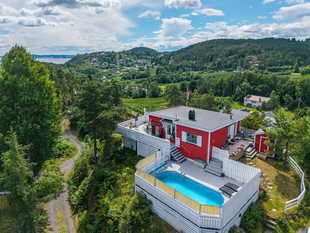 Front view of the cabin and pool area