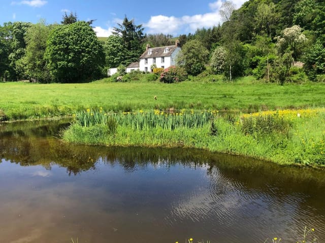 Front view of Barbuie farmhouse and gardens