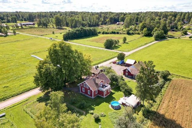 Front view of the country home and stables
