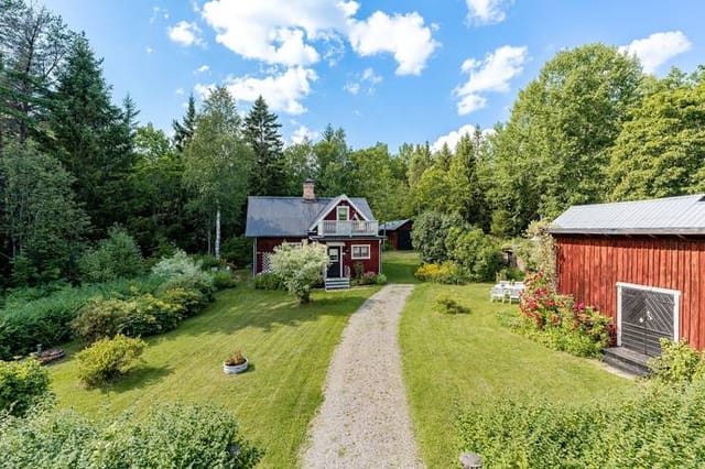 Front view of the cottage and garden