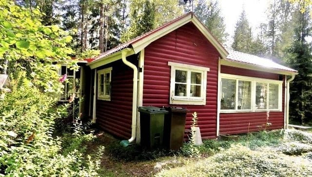 Exterior view of the red summer cottage