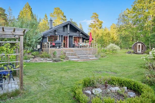Exterior view of the timber house and garden