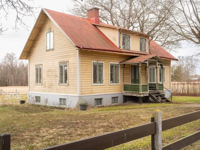 Front view of the farmhouse and garden