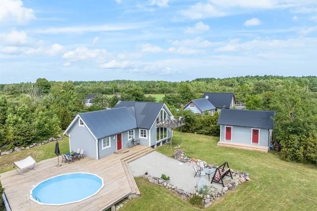 Exterior view of the house and pool